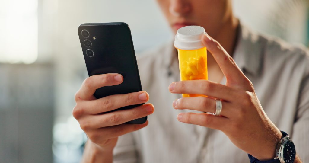 Patient checking medicine prices with app